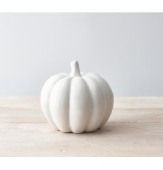  Sure to bring a sleek look to any home space or festive display, a stylishly simple ceramic pumpkin with a silver stem 