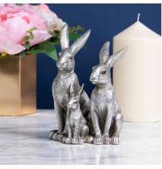 A gorgeously detailed ornament made up of a family of 3 Hares 