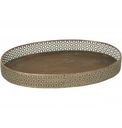 A large decorative metal tray with a tarnished bronzed colouring and stunning floral surround 