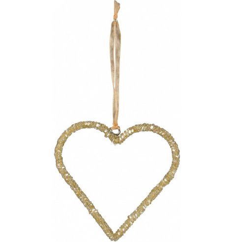A gold glitter based heart hanger with an organza ribbon for hanging 
