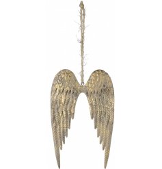 An overly tarnished gold pair of hanging wings with a jute string 