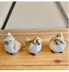 A cute and festive mix of posed bird figures with tarnished gold touches 