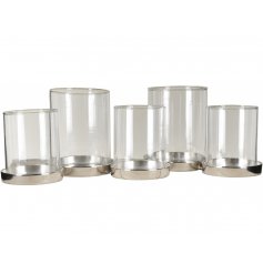 A sleek and simple themed candle holder with assorted sized glass cylinder inserts 