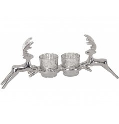 a silver candle stand with a stag inspired decal 