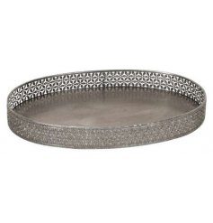 A gorgeously vintage themed iron based display tray with a floral pattern surround 