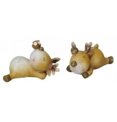 An adorable assortment of sleepy reindeer figures complete with rustic features and perched critters on their heads 