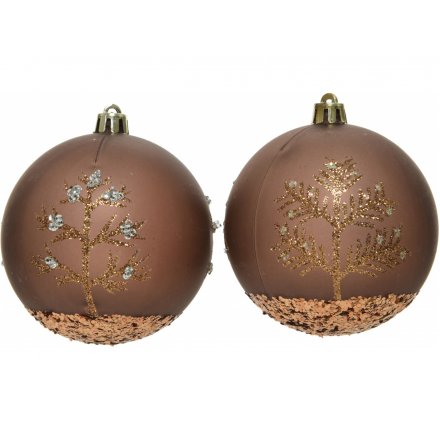 An assortment of luxe bronzed bauble with glittery touches and printed tree patterns 