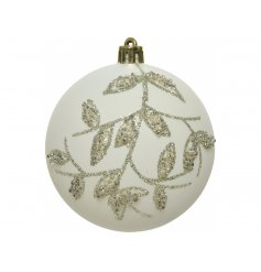 An elegantly designed white based glass bauble, set with a glittery leaf decal to complete its look 