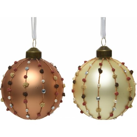 A mix of assorted hanging glass baubles, each set with a stunning glittery pompom inspired decal