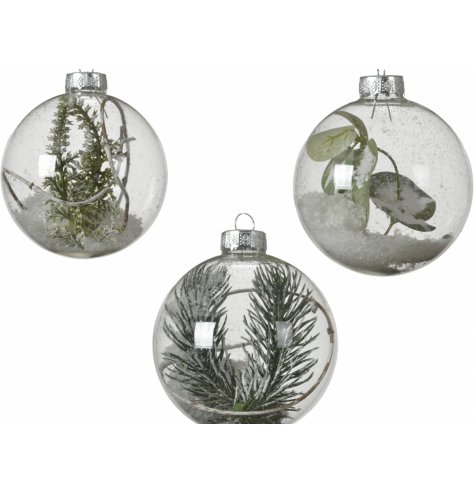 A mix of clear glass baubles, each filled with glittery flurries and foliage finishes 