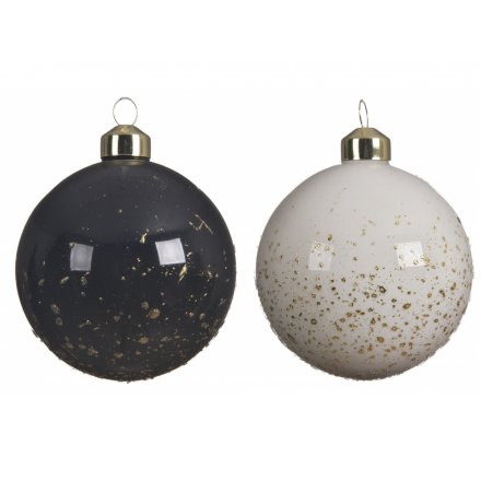 A mix of white and black base toned glass baubles, each set with a golden glitter splatter effect 