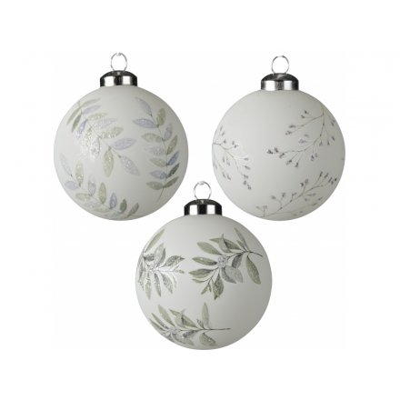 a mix of white glass baubles with a foliage print to each 