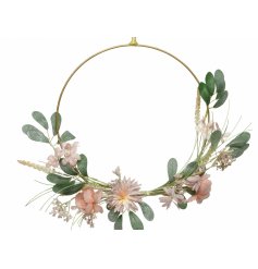 A gorgeous floral inspired Wreath with a half covered look and delicate flower and foliage finish  