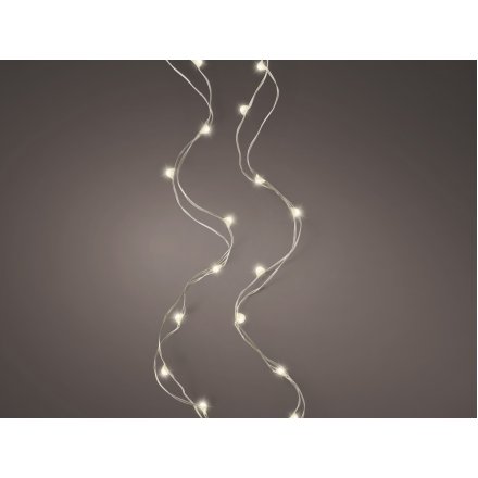 Spruce up simple accessories, wreaths and garlands. A string of warm glowing Micro LED lights on a silver wire 