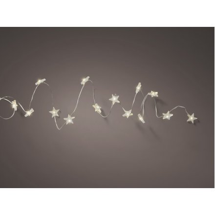Spruce up simple accessories, wreaths and garlands. A string of warm glowing Micro LED lights on a silver wire 