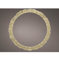  A stunningly simple round shaped wire LED decoration set with a Macrame tassel finish and warm glowing LED light 
