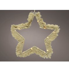  A stunningly simple star shaped wire LED decoration set with a Macrame tassel finish and warm glowing LED light 