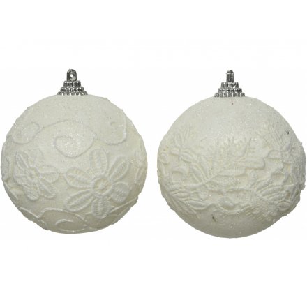 A mix of foam based bauble, each coated in a shimmery white glitter and topped with a netted floral decal 
