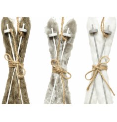 A fuzzy assortment of hanging ski decorations, each complete with its own colouring and added jute string touch 