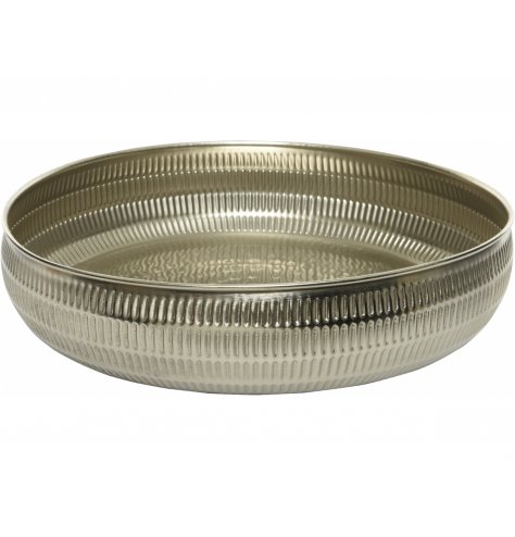 A tarnished silver toned metal bowl featuring a hammered edging, perfect for decorative use on table centres 