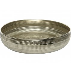   A distressed silver toned decorative bowl with a hammered embossment to surround it 