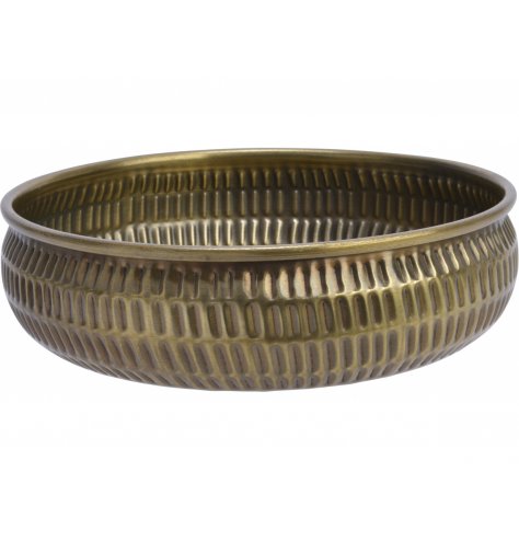 A tarnished gold toned metal bowl featuring a hammered edging, perfect for decorative use on table centres 