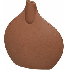  A stunningly simple designed flat shaped vase with a terracotta tone and trendy look 