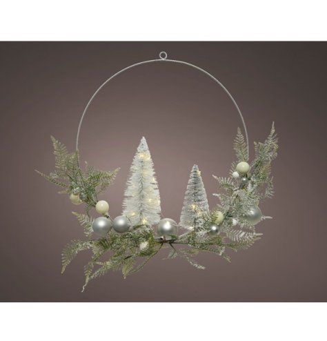 A foliage filled wire wreath with added frosted foliage finishes and warm glowing LED lights 