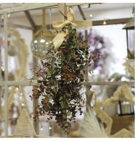A charming alternative to hanging Mistletoe, a artificial Eucalyptus bunch with a hessian bow to finish 