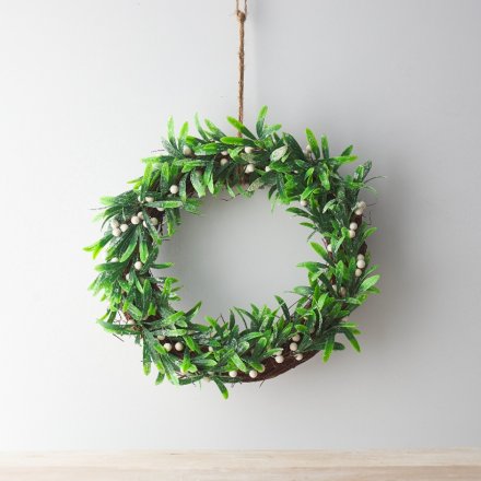 A chic round wreath with artificial mistletoe and a jute string hanger.
