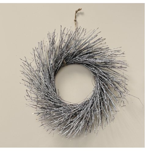 A natural birch wreath with an array of real twigs, each set with a subtle white wash 