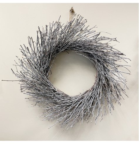 A natural birch wreath with an array of real twigs, each set with a subtle white wash 