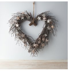 A beautifully rustic natural birch twig wreath complete with glittery stars and pinecones 