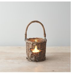  Sure to bring a Country Charm feel to any space of the home, a woven wicker candle holder with a small star window 