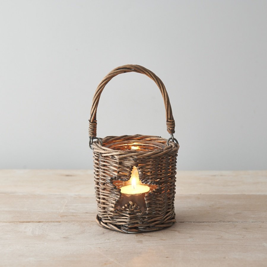  Sure to bring a Country Charm feel to any space of the home, a woven wicker candle holder with a small star window 