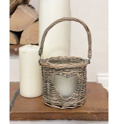 Sure to bring a Country Charm feel to any space of the home, a woven wicker candle holder with a small heart window 