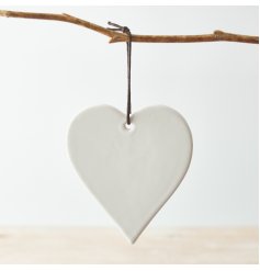   A sweet and simple hanging heart shaped decoration complete with a black string