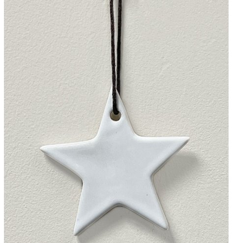 A simple ceramic star hanging decoration in a white tone, set with a black string hanger 