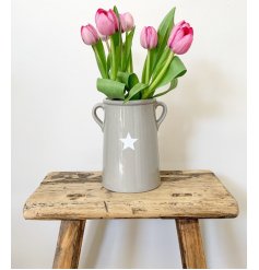 Display your favourite handpicked blooms in this stylish ceramic vase. Complete with small handles and a star design.