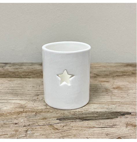 A simple white tlight holder with a star cut decal to feature, a sweet and simple accent for the home 