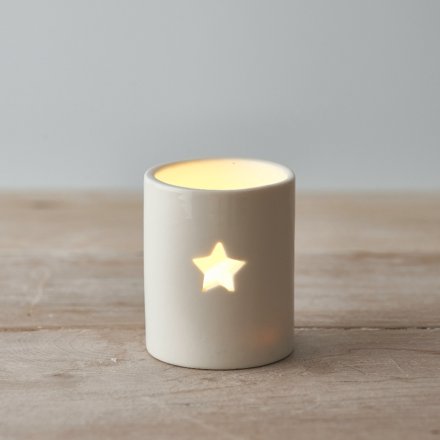 A sleek and simple ceramic tlight holder with a small star cut decal to complete its look 
