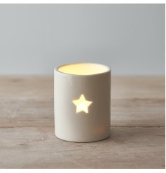 A sleek and simple ceramic tlight holder with a small star cut decal to complete its look 