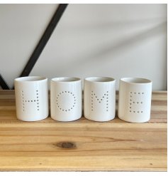A sleek and simple set of white ceramic tlight holders, each complete with a pin dot HOME text decal 