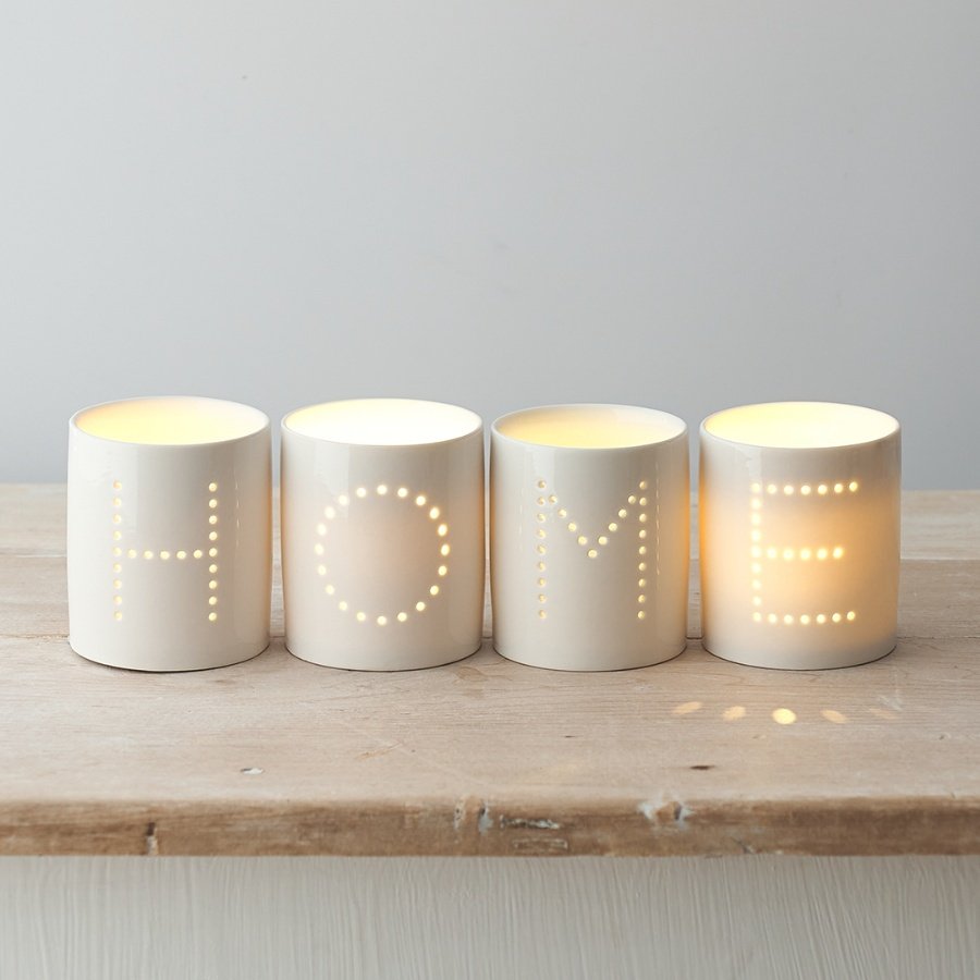 A sleek and simple set of white ceramic tlight holders, each complete with a pin dot HOME text decal 