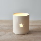 A sleek and simple ceramic tlight holder with a small star cut decal to complete its look 