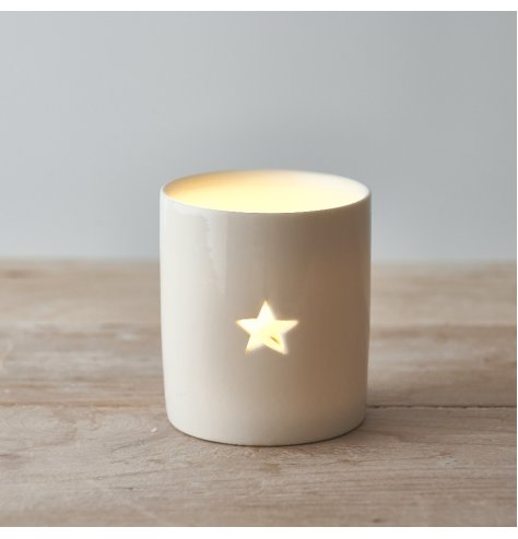 A simple white tlight holder with a star cut decal to feature, a sweet and simple accent for the home 