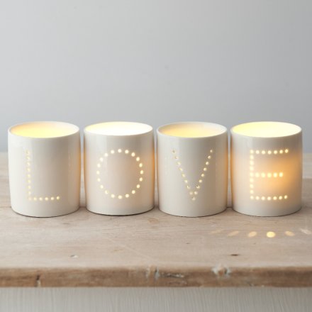 A Sleek and Stylish Set of Ceramic T-Light Holders with Dotted Wording