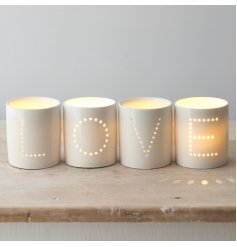 A Sleek and Stylish Set of Ceramic T-Light Holders with Dotted Wording