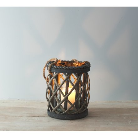 A small lantern featuring a willow lattice decal and chunky rope handle to finish 