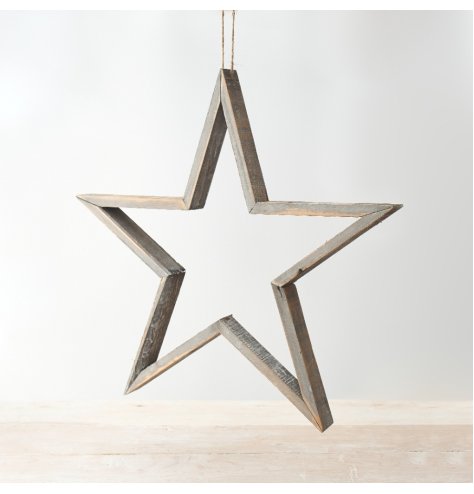 A large wooden star shaped decoration with a jute string hanger.